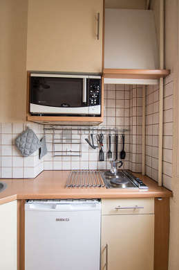 Kitchen where you can have dinner for 2 person(s) equipped with hob, refrigerator, freezer, crockery