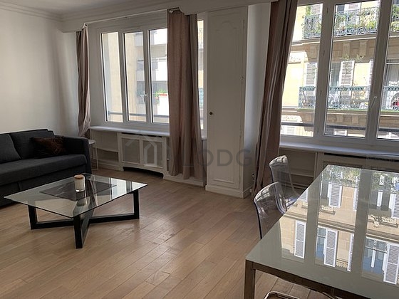 Living room with windows facing the road