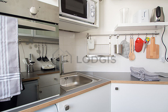Kitchen equipped with washing machine, dryer, refrigerator, freezer