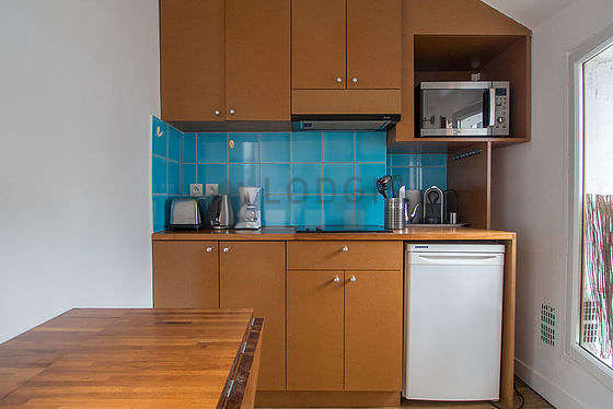 Kitchen where you can have dinner for 3 person(s) equipped with washing machine, dryer, refrigerator, extractor hood