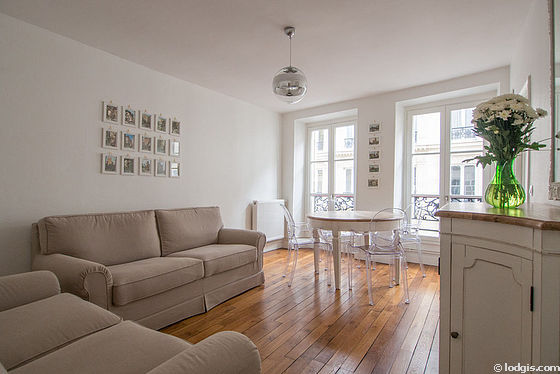 Quiet living room furnished with sofa, 4 chair(s)