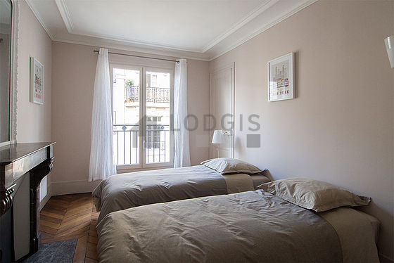 Bedroom with double-glazed windows and balcony facing the road
