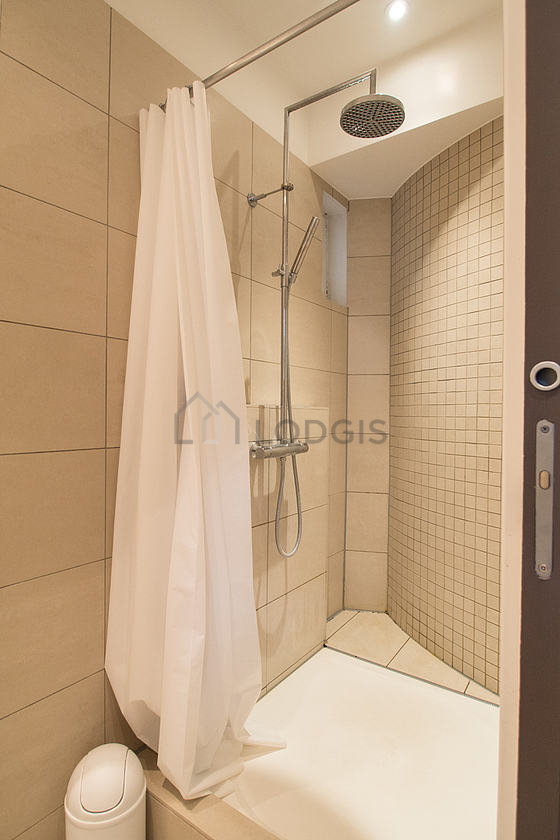 Bathroom equipped with separate shower, towel drying radiator