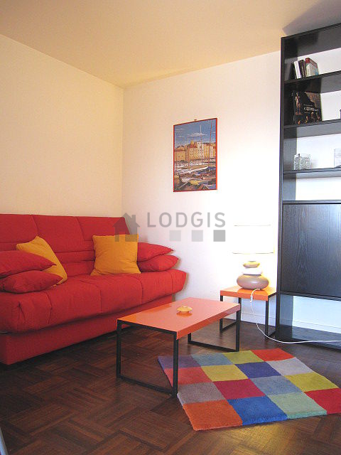 Living room with windows and balcony