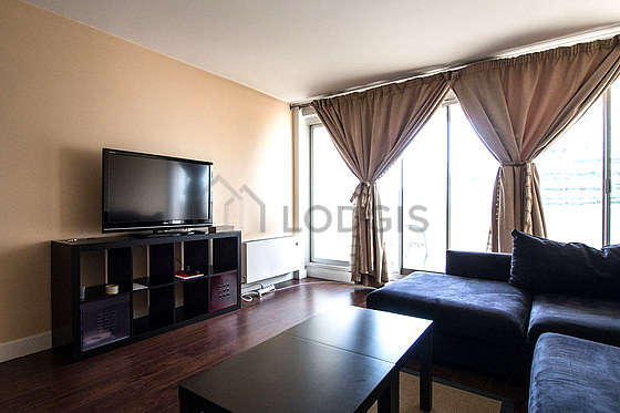 Quiet living room furnished with tv, 4 chair(s)