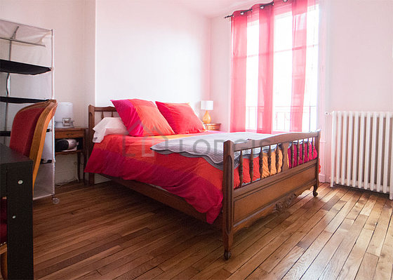 Bedroom with wooden floor
