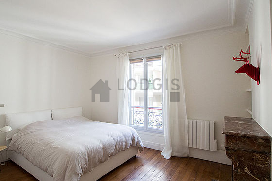 Bedroom with wooden floor
