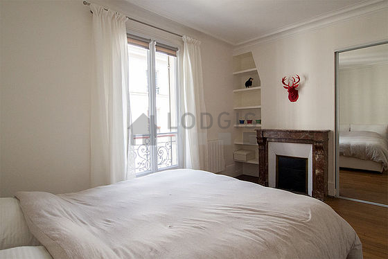 Bedroom with double-glazed windows facing the road