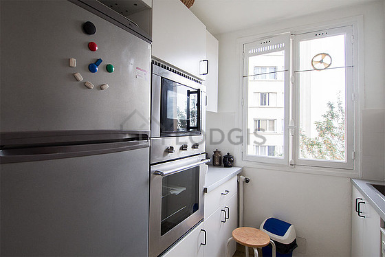 Bright kitchen with windows facing the courtyard