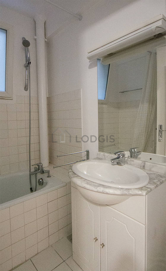 Beautiful bathroom with windows and with tile floor