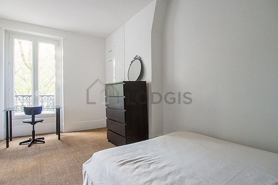 Bedroom with double-glazed windows facing the road