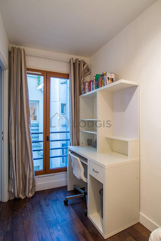Bedroom with double-glazed windows facing the courtyard