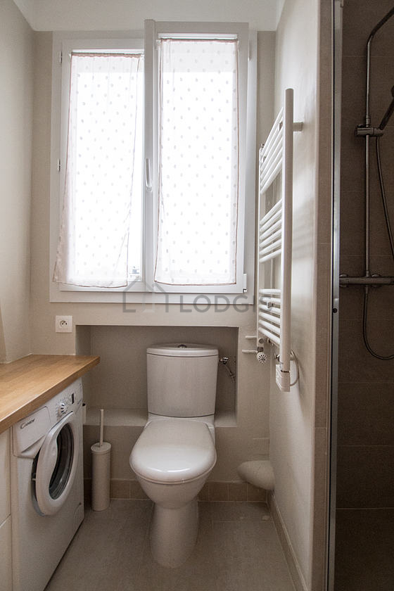 Bathroom equipped with washing machine, bath towels