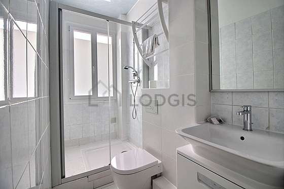 Pleasant and bright bathroom with windows and with tilefloor
