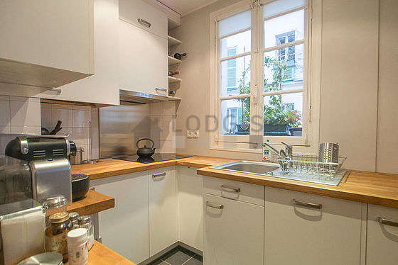 Bright kitchen with windows facing the road