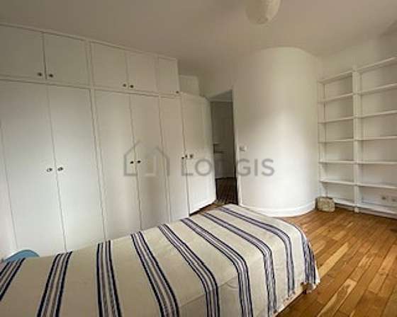 Bright bedroom equipped with wardrobe