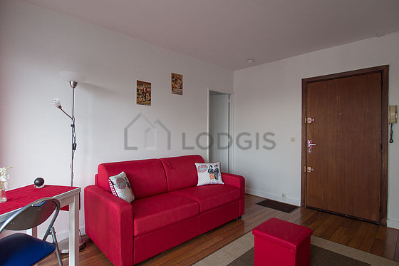 Living room with double-glazed windows facing the road