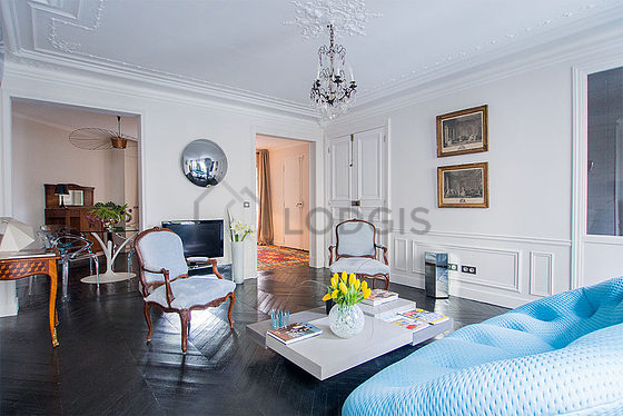 Living room with double-glazed windows facing the road