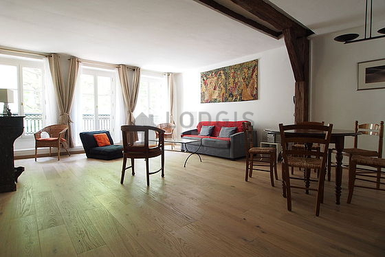 Living room with double-glazed windows facing the road