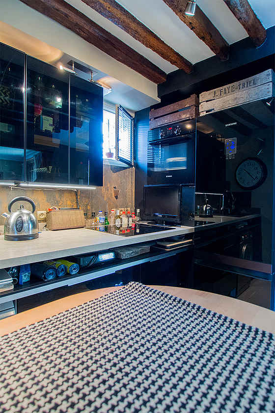 Kitchen equipped with washing machine, dryer, refrigerator, crockery