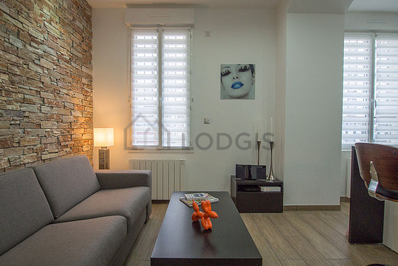 Living room with double-glazed windows facing the courtyard