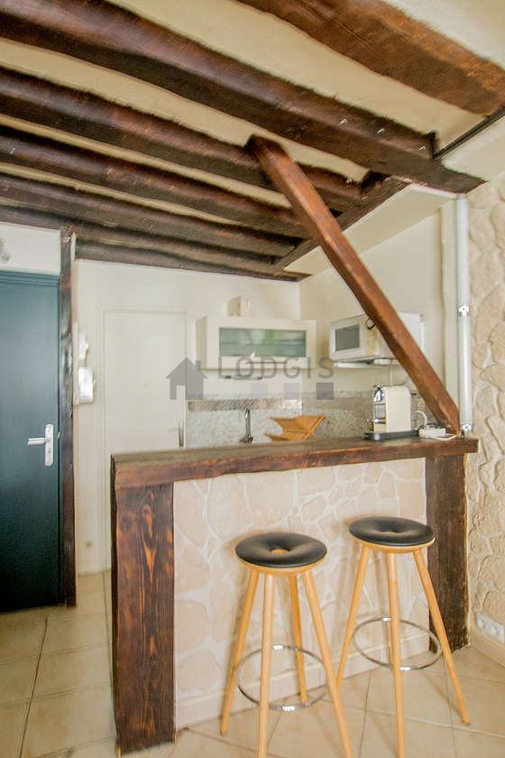 Kitchen where you can have dinner for 2 person(s) equipped with hob, refrigerator, freezer, crockery