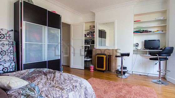 Bedroom with windows facing the road