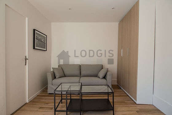 Quiet living room furnished with 1 sofabed(s) of 140cm, tv, wardrobe, cupboard