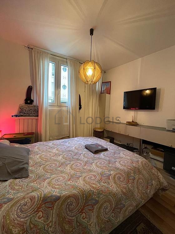 Bedroom with double-glazed windows facing the road