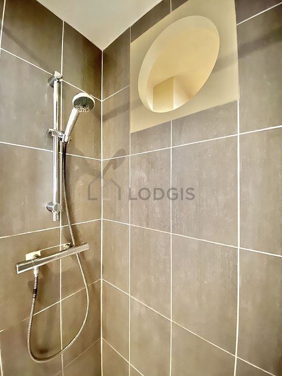 Bathroom with double-glazed windows and with tile floor