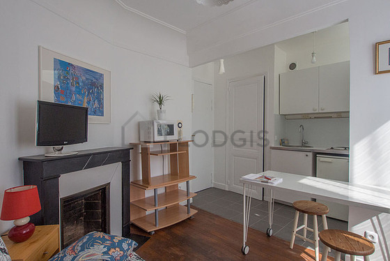 Living room with double-glazed windows facing the road