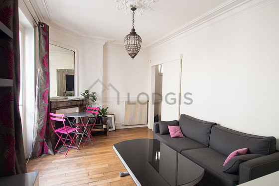 Living room with windows facing the courtyard