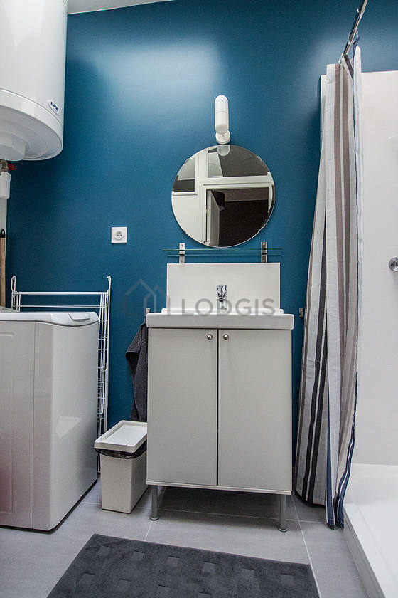 Bathroom equipped with washing machine, bath towels
