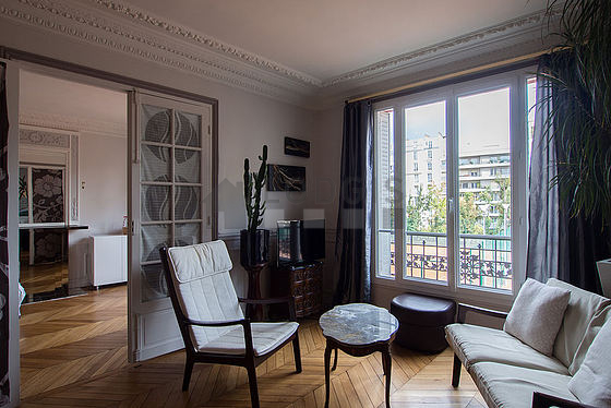 Quiet living room furnished with tv, dvd player, 1 armchair(s), 4 chair(s)