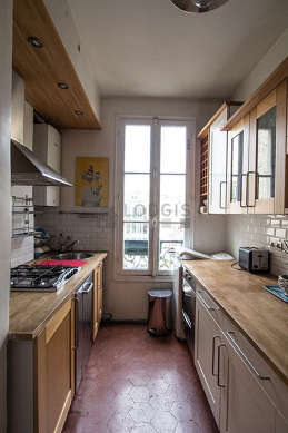 Bright kitchen with windows facing the courtyard