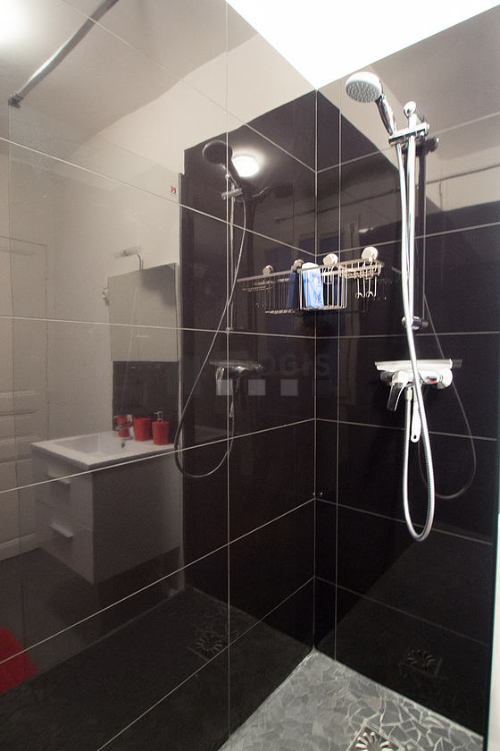 Bathroom equipped with washing machine, bath towels