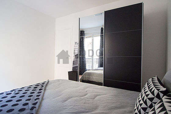 Very bright bedroom equipped with closet