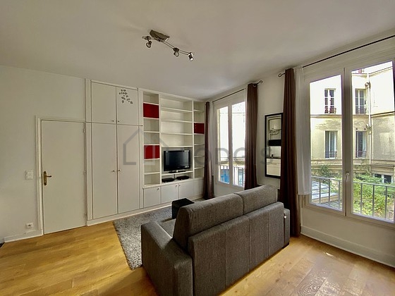 Quiet living room furnished with 1 sofabed(s) of 140cm, tv, wardrobe, cupboard