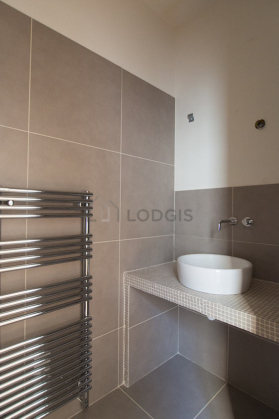 Pleasant and bright bathroom with tile floor