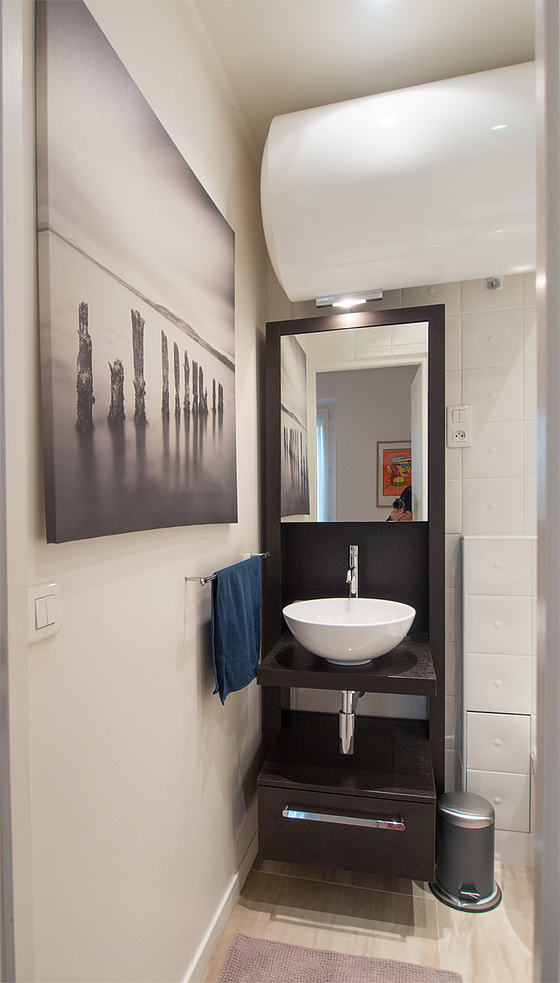 Bathroom equipped with washing machine, cupboard