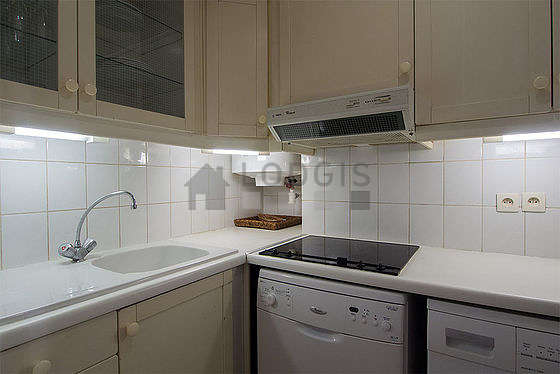 Kitchen equipped with washing machine, dryer, refrigerator, freezer