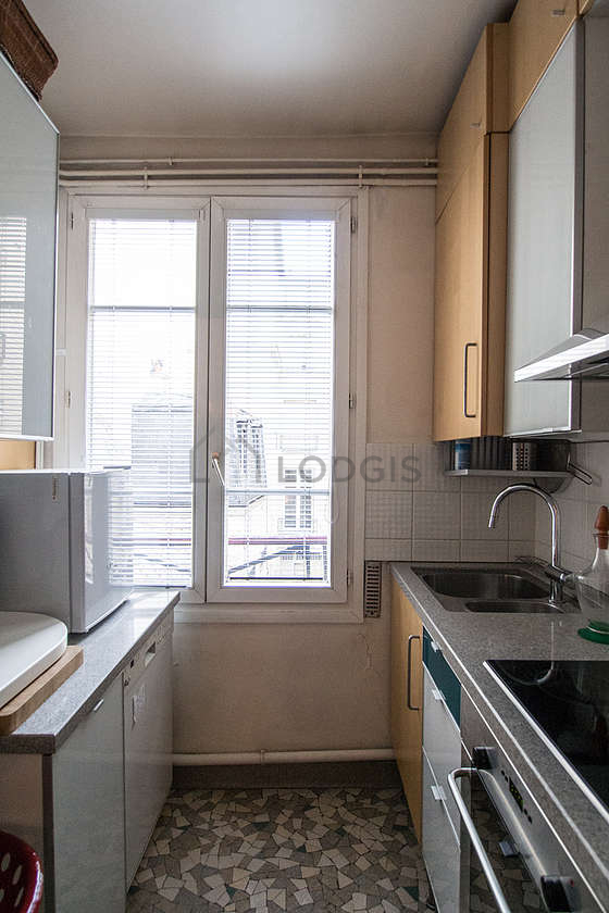Kitchen where you can have dinner for 2 person(s) equipped with dishwasher, hob, refrigerator, extractor hood
