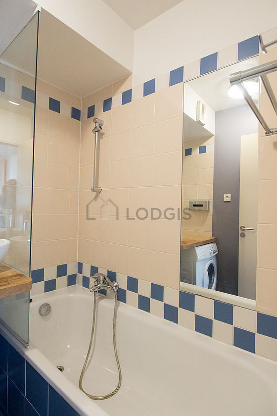 Bathroom equipped with washing machine, bath towels