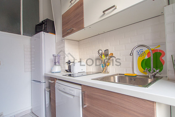 Bright kitchen with double-glazed windows facing the road