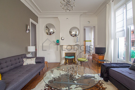 Quiet living room furnished with tv, 1 armchair(s)