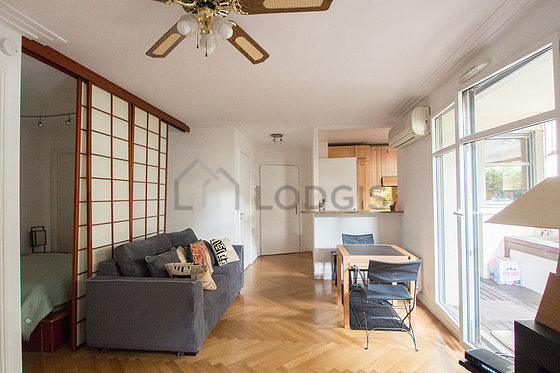 Living room with double-glazed windows facing the road