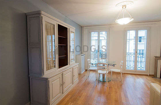 Quiet living room furnished with 1 sofabed(s) of 160cm, dining table, wardrobe, cupboard