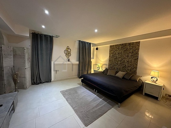 Bedroom with tile floor