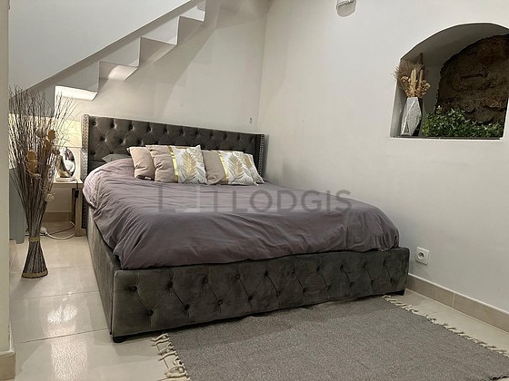 Bedroom with tile floor