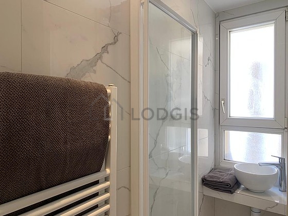 Beautiful and bright bathroom with double-glazed windows and with tile floor